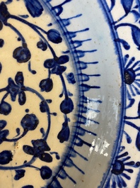 A blue and wite Iznik dish with floral design, Turkey, late 16th C.